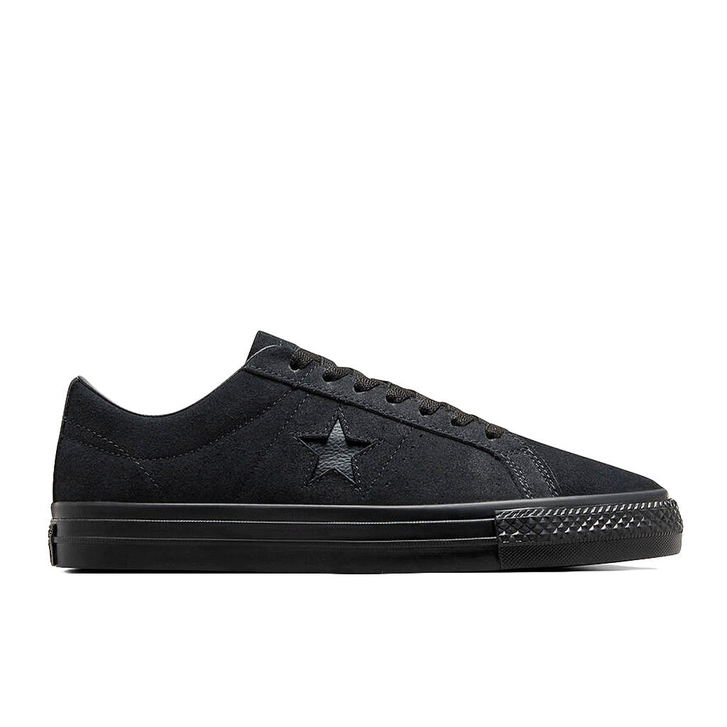 Black sneaker with a star logo on a white background