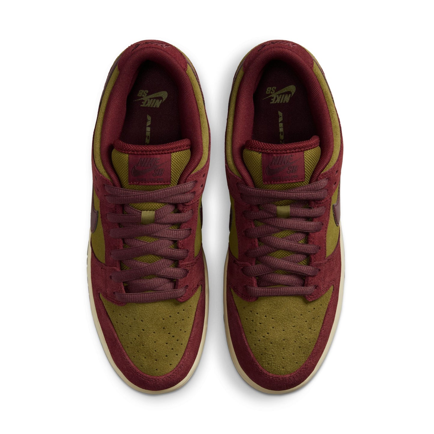 Pair of maroon and green sneakers on a white background