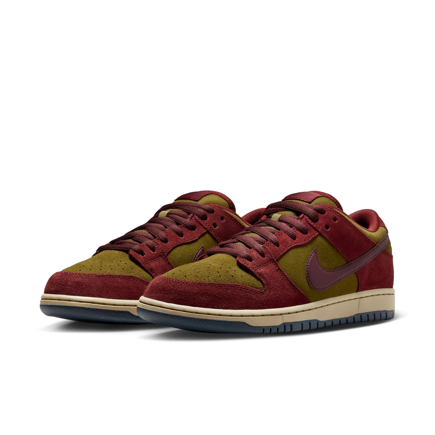 Red and green sneakers with a Nike logo on a white background