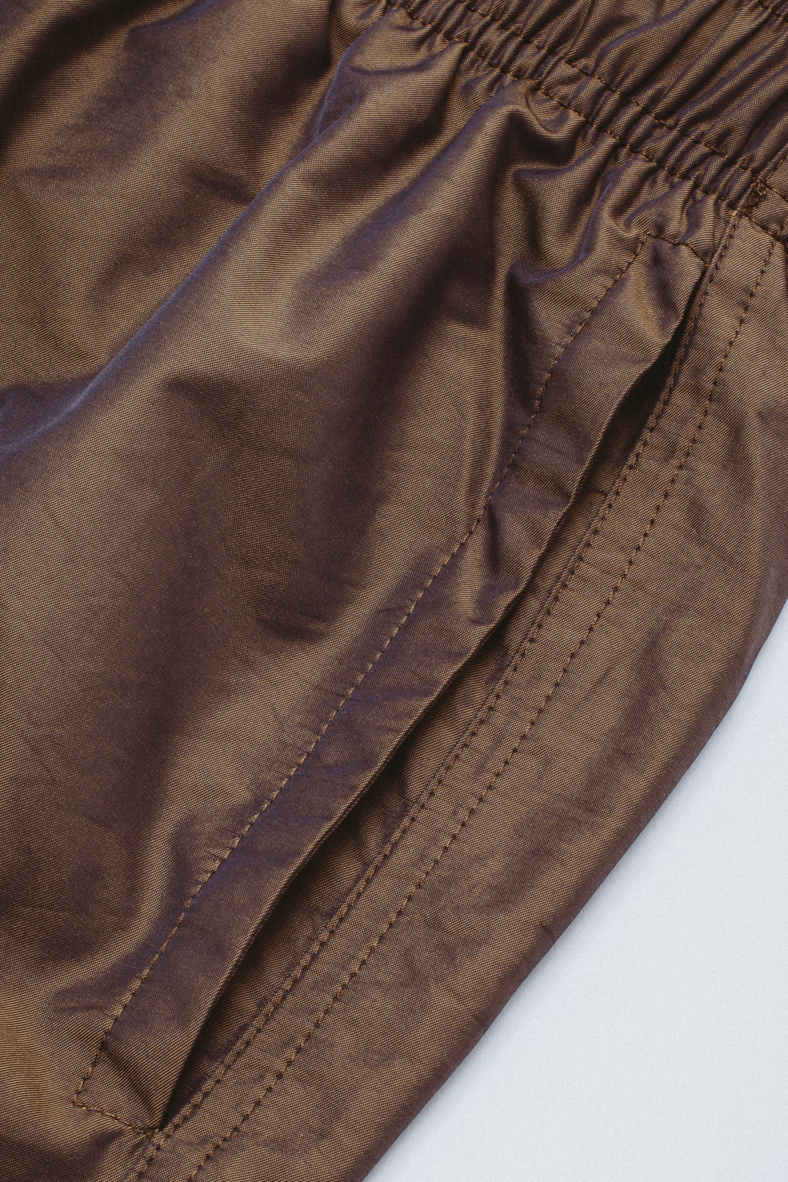 Close-up of brown fabric with a white background