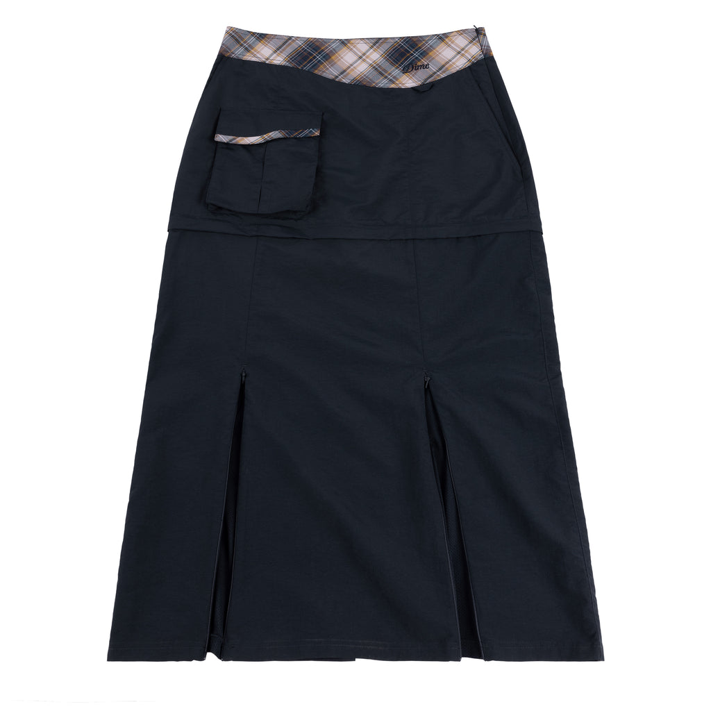 Dime Tech Skirt in plaid navy shown on model, featuring cargo pocket and front slit