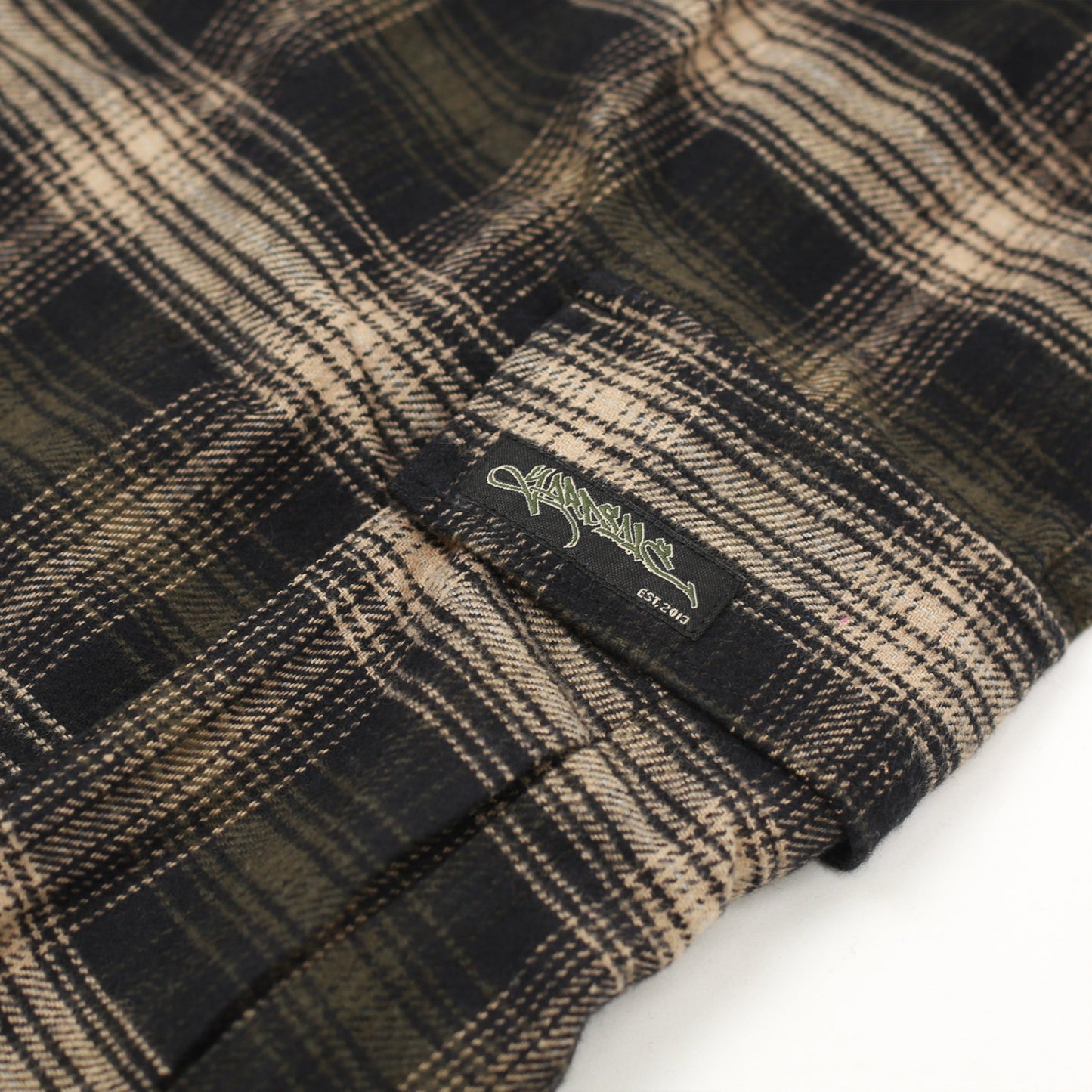 Close-up of side cargo pocket on Yardsale Shoreline plaid shorts brown