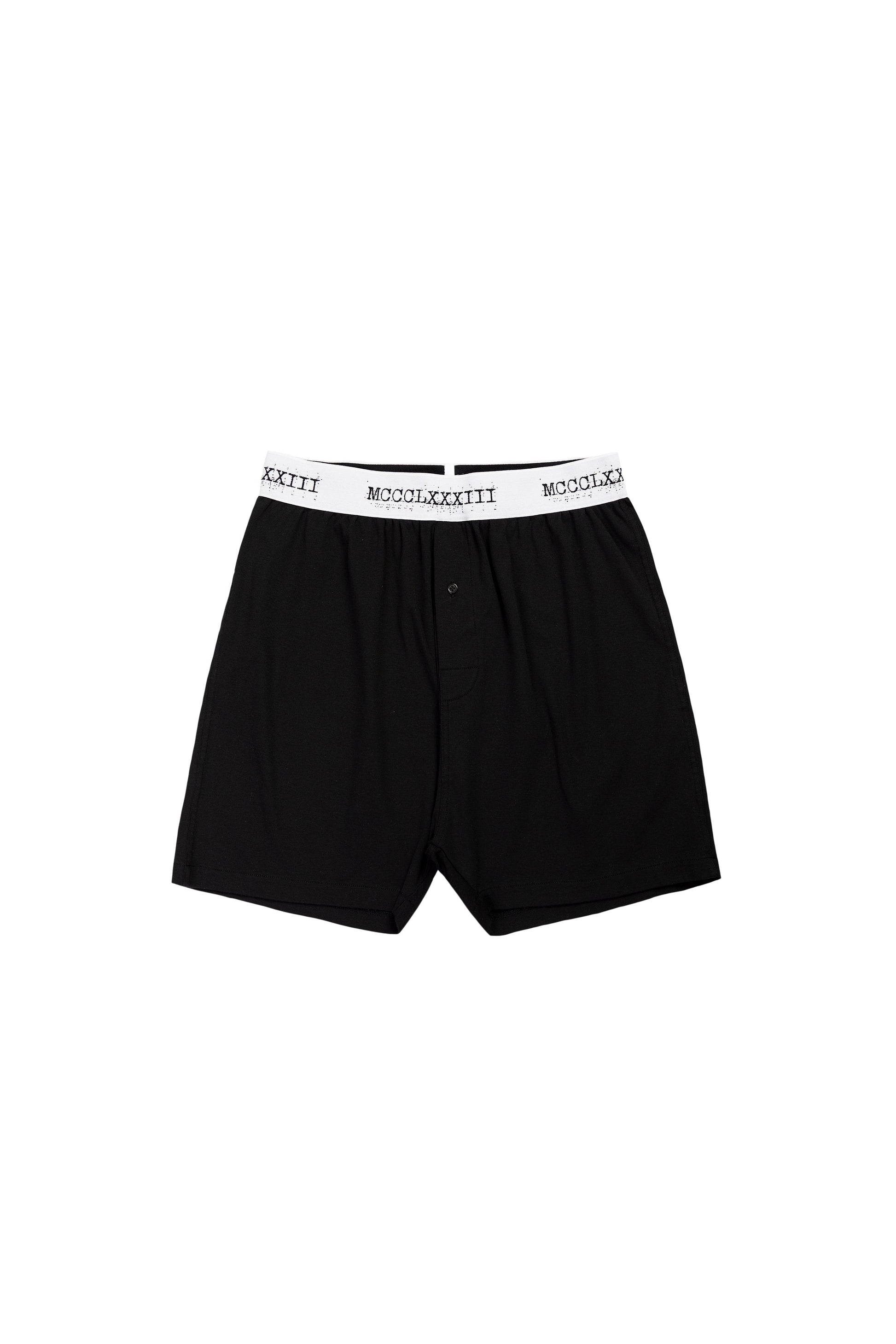 Black boxer briefs with white waistband on a white background