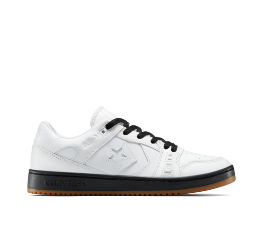 White sneaker with black accents on a white background