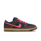 Sneaker with brown, blue, and pink color scheme on a white background