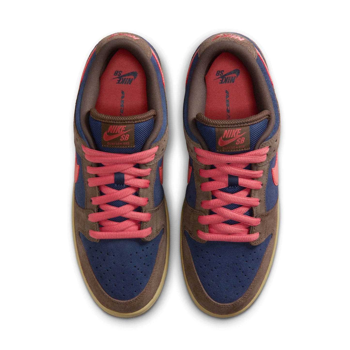 Pair of Nike SB sneakers with brown, blue, and pink color scheme on a white background