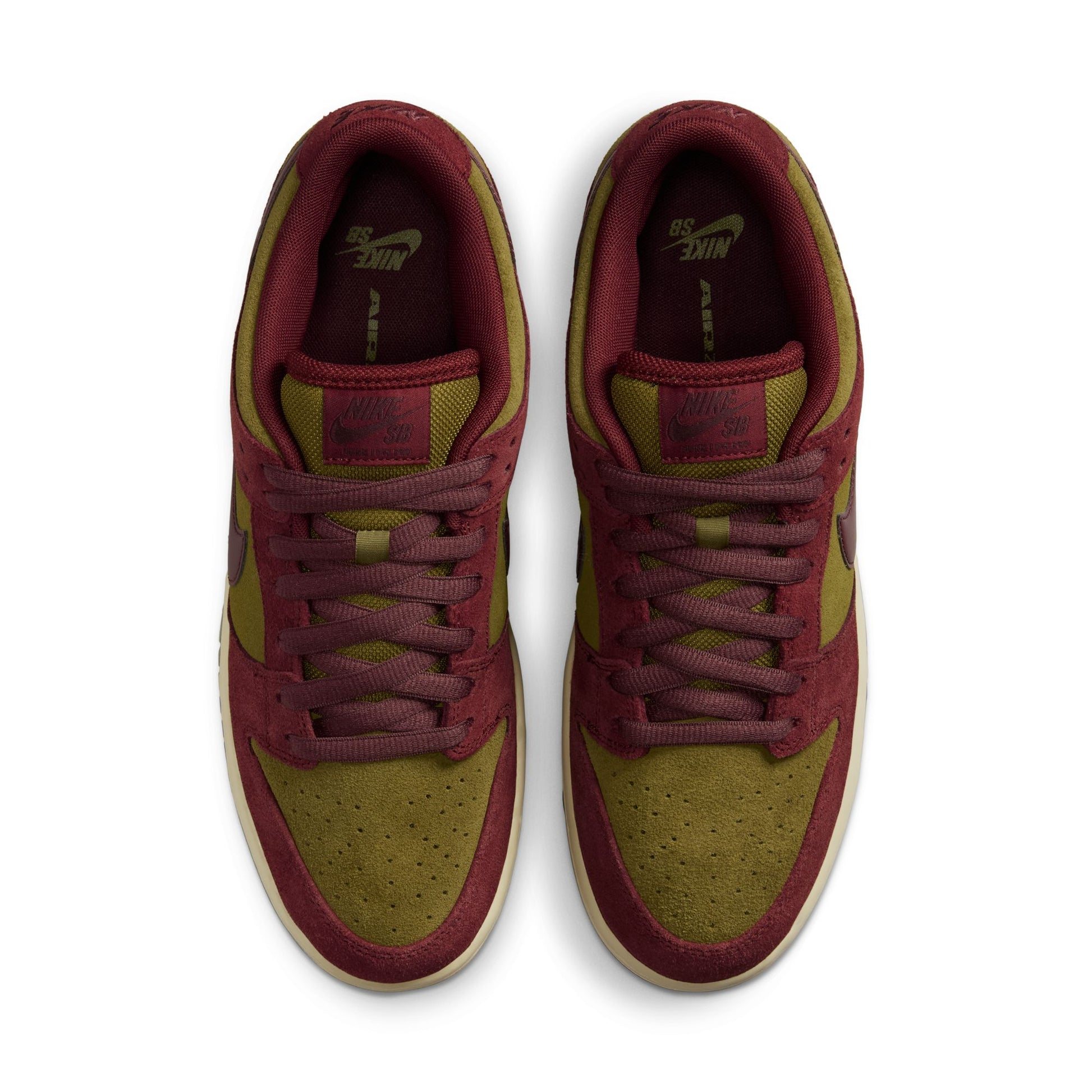 Pair of maroon and green sneakers on a white background