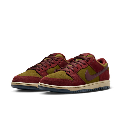 Red and green sneakers with a Nike logo on a white background