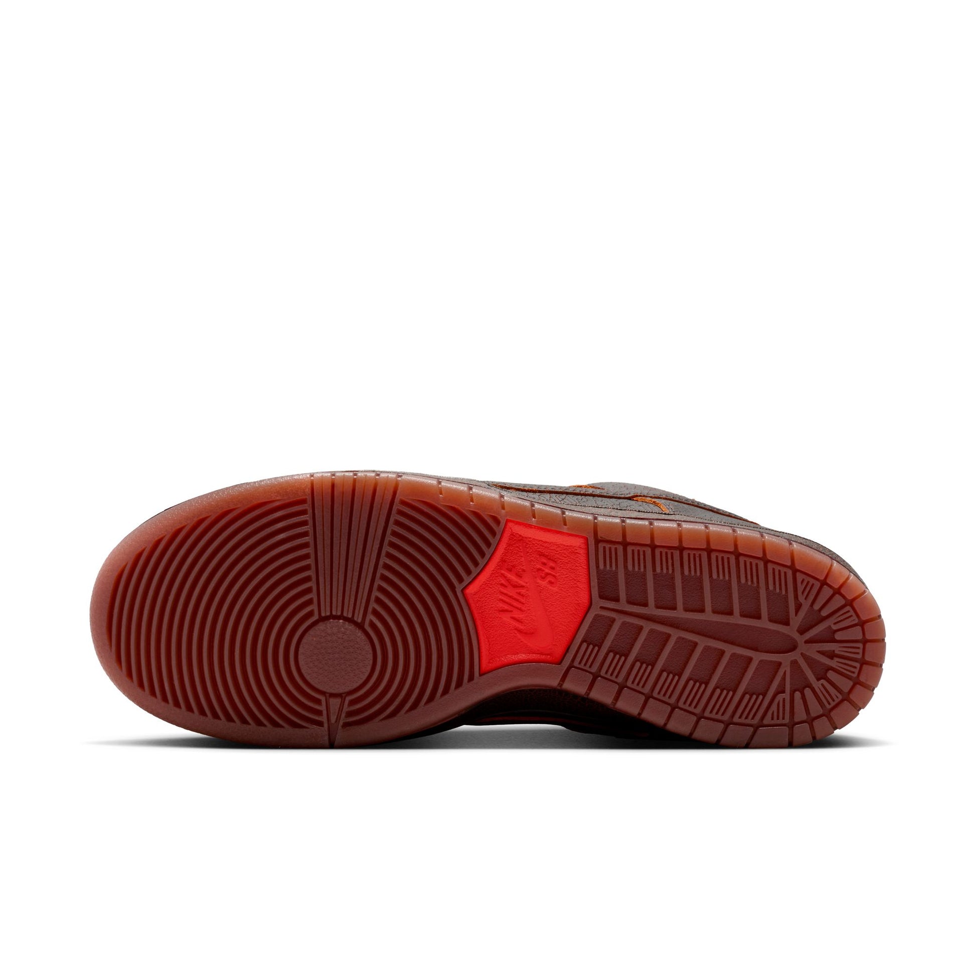 Brown shoe sole with red accent on a white background