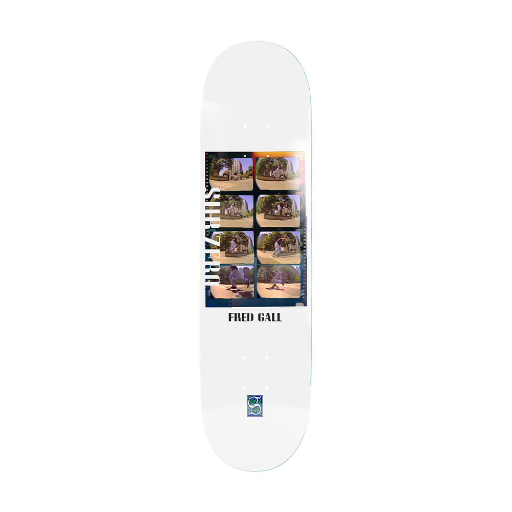 A white skateboard deck featuring a graphic collage of Fred Gall skate photos in a film-strip style, with 'FRED GALL' printed in black text and a small blue logo near the bottom.