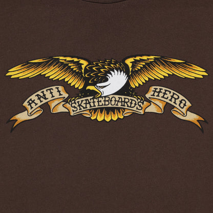 Brown t-shirt with a yellow and black eagle graphic and text on a brown background