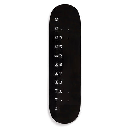 Black skateboard deck with Roman numeral design on a white background