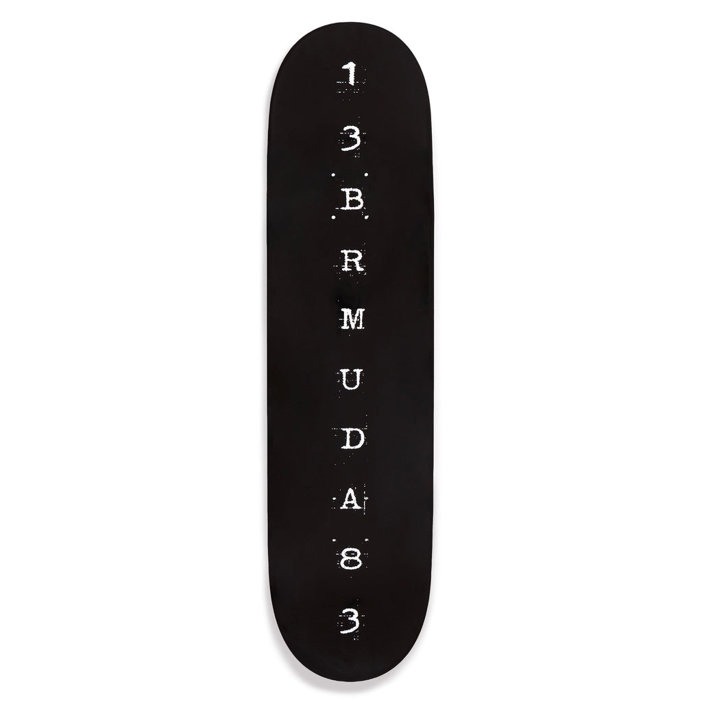 Black skateboard deck with white text on a white background