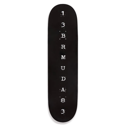 Black skateboard deck with white text on a white background