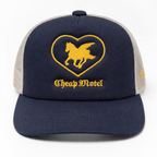 Navy blue and beige cap with a heart-shaped logo and 'Cheap Motel' text on a white background