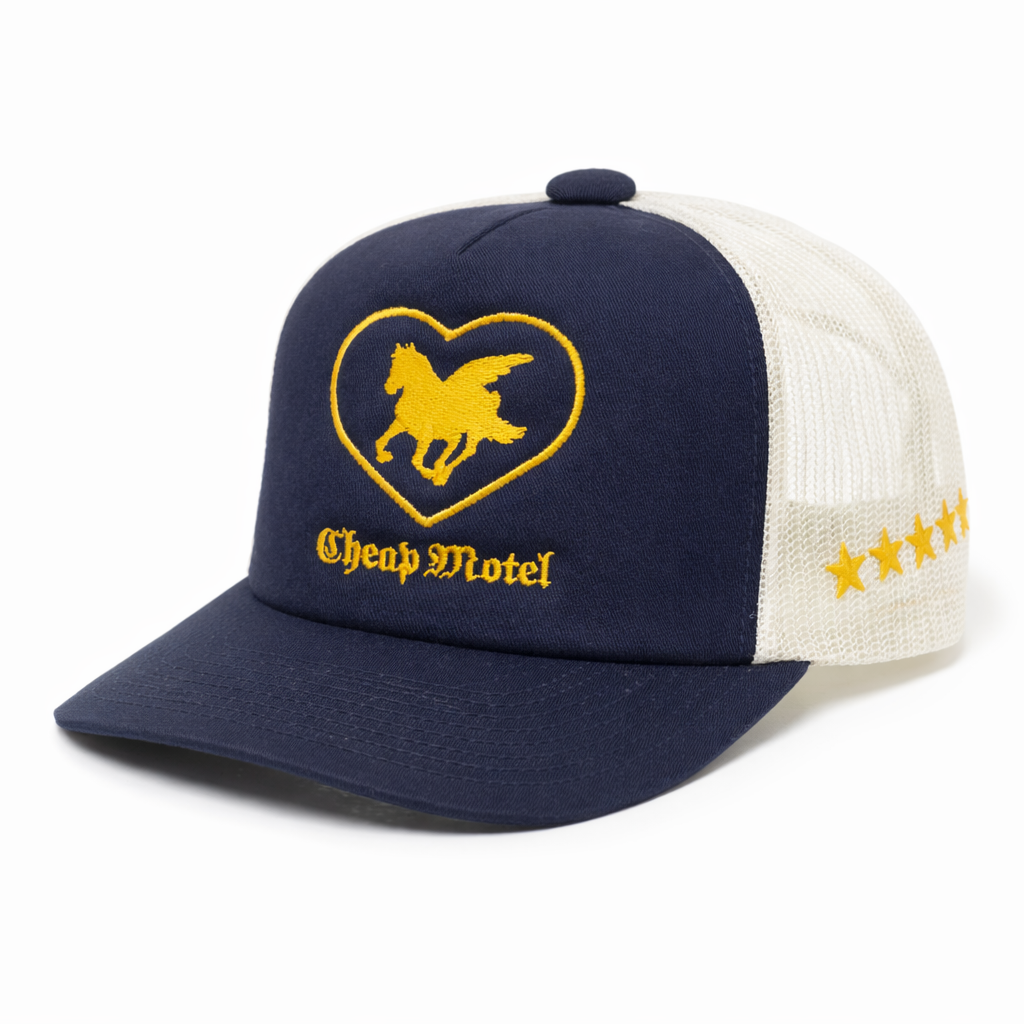Navy and white cap with yellow heart design and 'Cheap Motel' text on a white background