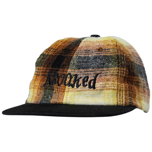 Plaid patterned cap with 'Krooked' branding on a white background