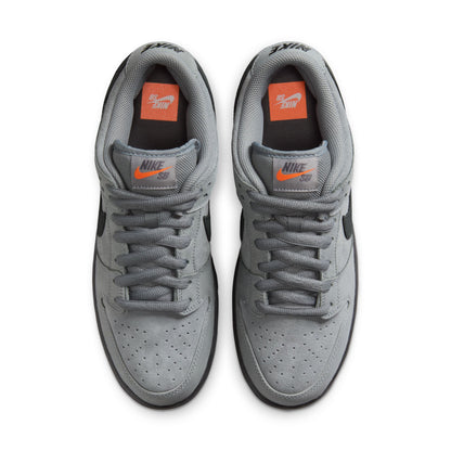 Gray sneakers with orange accents on a white background