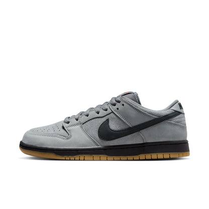 Gray sneaker with black swoosh logo on a white background