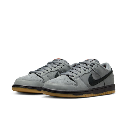 Gray sneakers with a black logo on a white background