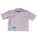 A short-sleeve button-up shirt with a pink and white gingham check pattern, featuring a small blue graphic on the lower left front, displayed flat against a white background.