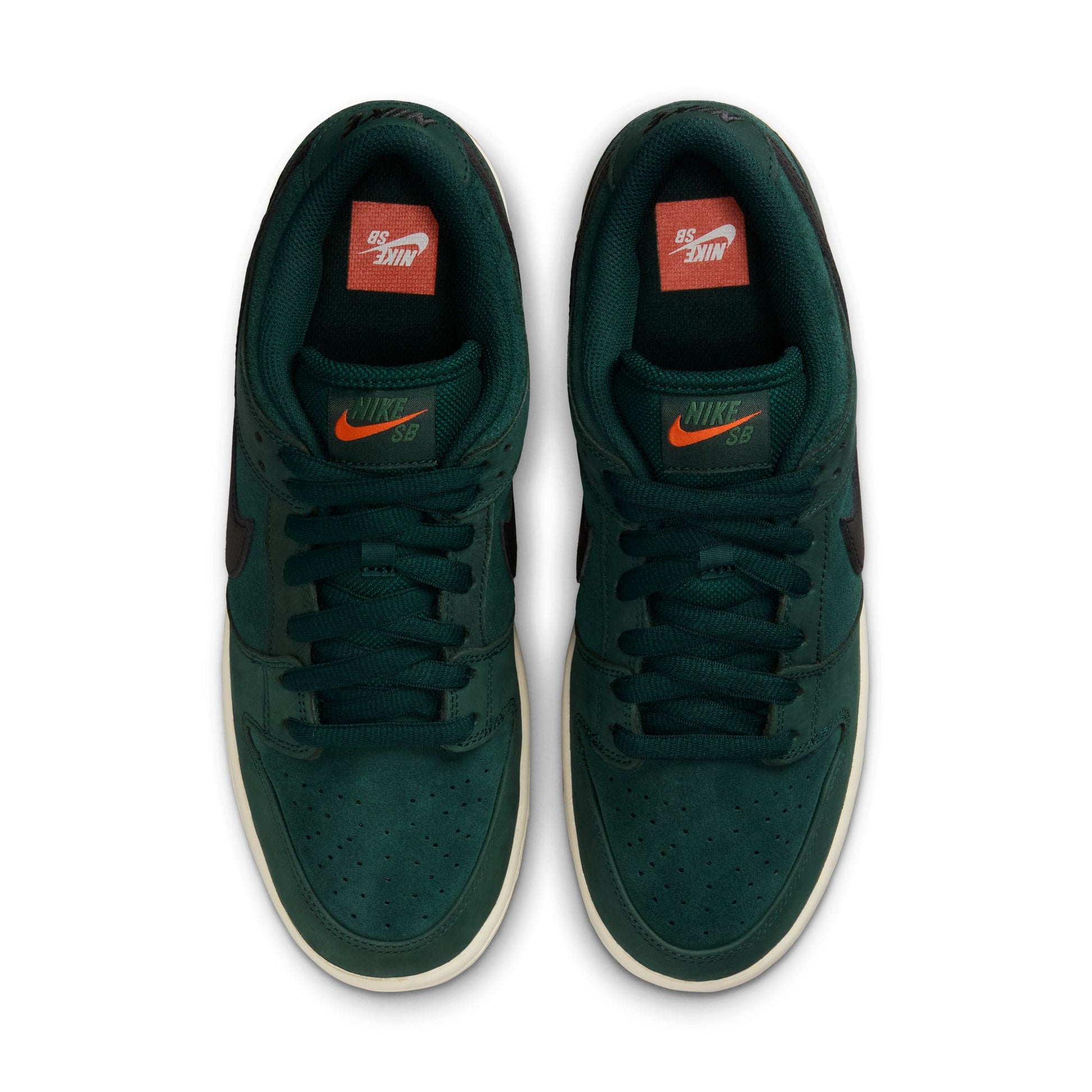 Green Nike sneakers with orange swoosh logo on a white background