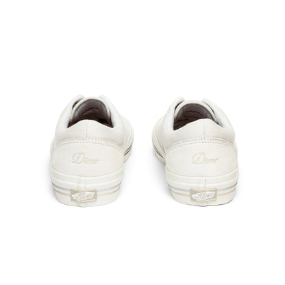 White sneakers with a brand logo on a white background